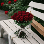 Rustic wooden bench adorned with a vibrant mix of blooming roses.