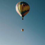A scenic view of a colorful hot air balloon in flight, showcasing the beauty and wonder of aerial exploration.