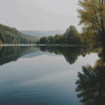 Captivating image of a peaceful lake reflecting the vibrant colors of a sunset, creating a serene natural canvas.