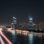 Shimmering city lights reflecting on the water, showcasing urban beauty.
