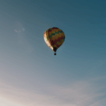 A majestic hot air balloon journey through the clouds, offering an exhilarating sky adventure experience.
