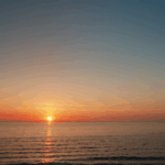 A stunning ocean sunset with vibrant colors illuminating the tranquil sea.