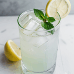 A cool drink of lemonade with mint and plenty of ice.
