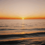 Sunset beauty over the water, with the sky reflecting warm, vibrant colors.