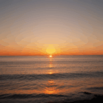Sunset peace over the sea, with vibrant colors illuminating the horizon.