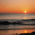 Sunset reflections over the calm sea, creating a picturesque ocean view.