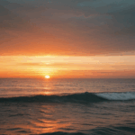 Sunset sea serenity with vibrant colors illuminating the horizon.