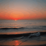 Sunset sky over the sea, with vibrant colors illuminating the horizon.