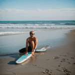 Surfboards resting on the sandy beach, ready for the next wave adventure.