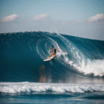 A fearless surfer expertly riding a towering ocean wave, capturing the essence of big wave surfing.