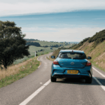 The thrill of hill driving experienced by a car navigating a scenic route.