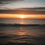 Tranquil sunset scenery with the sky ablaze in warm, vibrant hues.