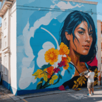 The lively urban art scene with a muralist working on a large-scale painting, reflecting the diversity of street art.