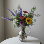 An elegant floral arrangement featuring a mix of wildflowers, adding a touch of rustic charm to any room.