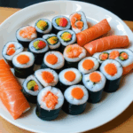 A vibrant display of colorful sushi rolls on a decorative plate.