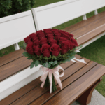 Blooming rose arrangement on a rustic bench, a visual feast for the senses.