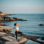 Yoga and meditation at the seaside, showcasing the blend of tranquility and the natural beauty of the beach setting.
